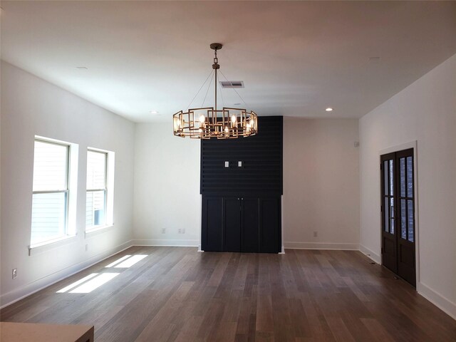 1217 Edwards St, Houston, TX 77007 - unfurnished dining area with a chandelier, wood finished floors, baseboards, and recessed lighting