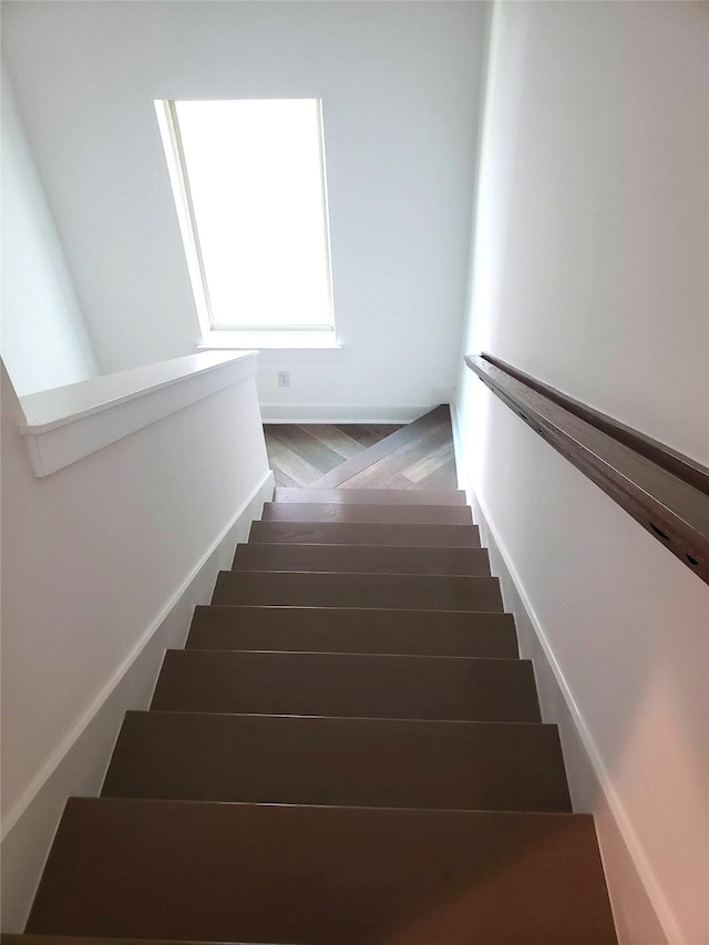 1217 Edwards St, Houston, TX 77007 - stairway featuring wood finished floors