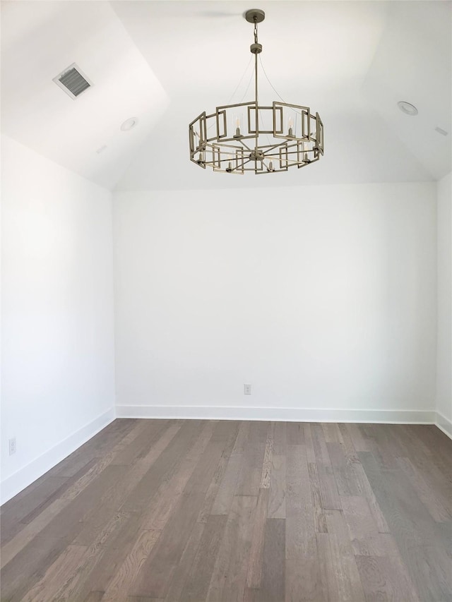 1217 Edwards St, Houston, TX 77007 - unfurnished dining area featuring vaulted ceiling, a chandelier, wood finished floors, and baseboards