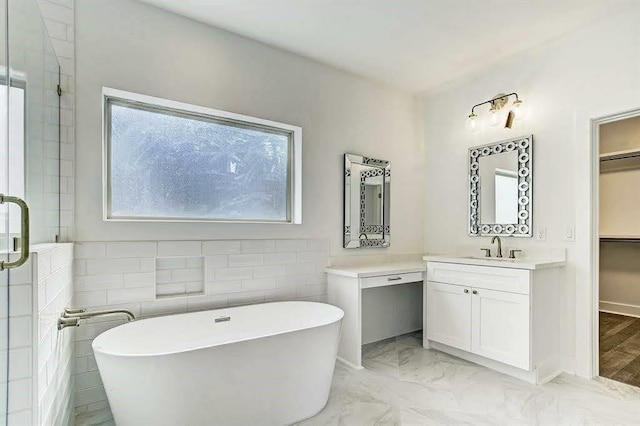 1217 Edwards St, Houston, TX 77007 - full bathroom with a freestanding tub, marble look tiles, vanity, and a stall shower