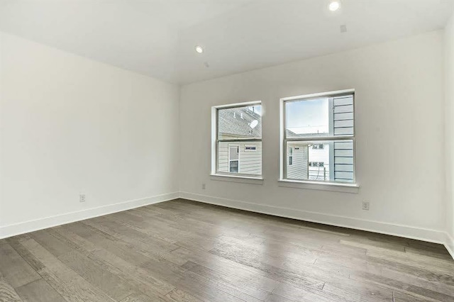 1217 Edwards St, Houston, TX 77007 - unfurnished room featuring dark wood finished floors, baseboards, and recessed lighting