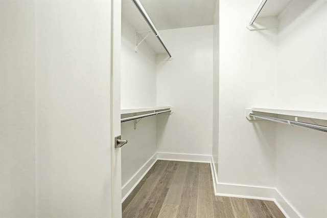 1217 Edwards St, Houston, TX 77007 - spacious closet featuring wood finished floors