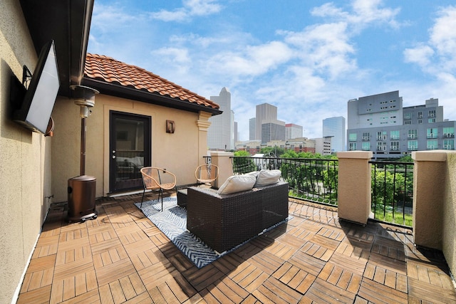 view of patio featuring a city view and a balcony