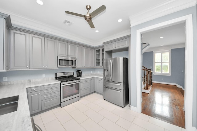 kitchen featuring gray cabinets, ceiling fan, visible vents, light countertops, and stainless steel appliances