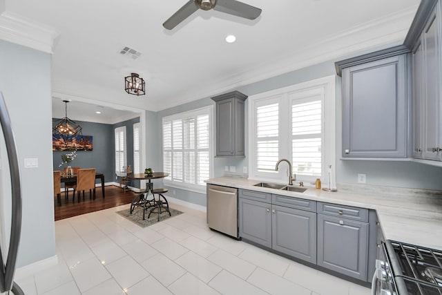 kitchen featuring visible vents, ornamental molding, a sink, appliances with stainless steel finishes, and gray cabinetry
