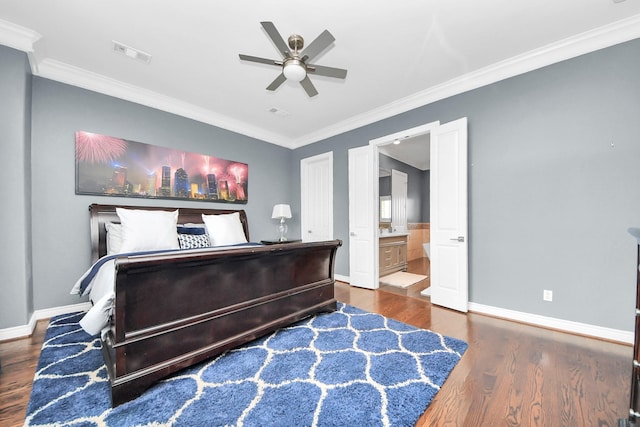 bedroom with visible vents, baseboards, crown molding, and wood finished floors