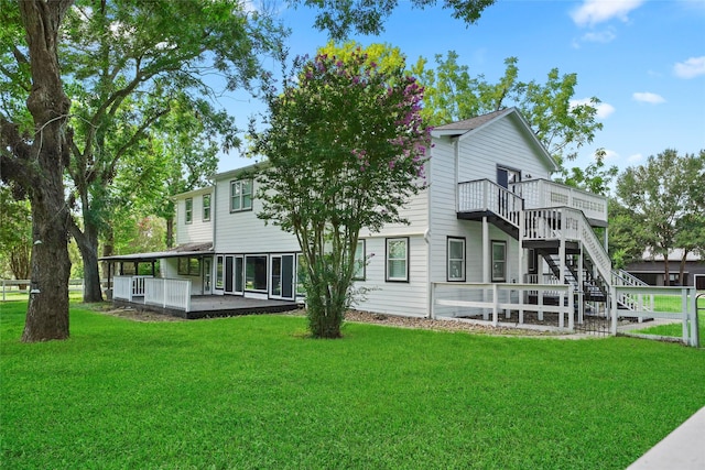 back of house featuring a yard and a patio