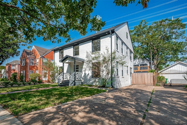 2102 Banks St, Houston, TX 77098 - view of front of property featuring a gate, driveway, fence, a front yard, and a residential view
