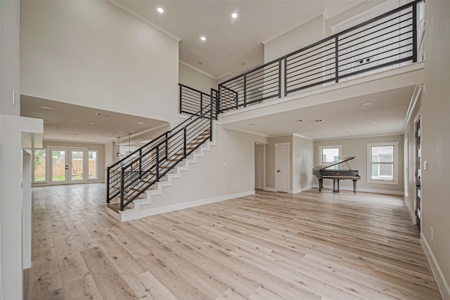 2102 Banks St, Houston, TX 77098 - interior space featuring stairway, ornamental molding, wood finished floors, and plenty of natural light