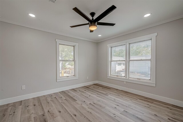 2102 Banks St, Houston, TX 77098 - unfurnished room featuring light wood-type flooring, plenty of natural light, baseboards, and crown molding