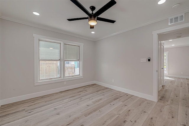2102 Banks St, Houston, TX 77098 - unfurnished room with a ceiling fan, ornamental molding, light wood-style floors, and visible vents