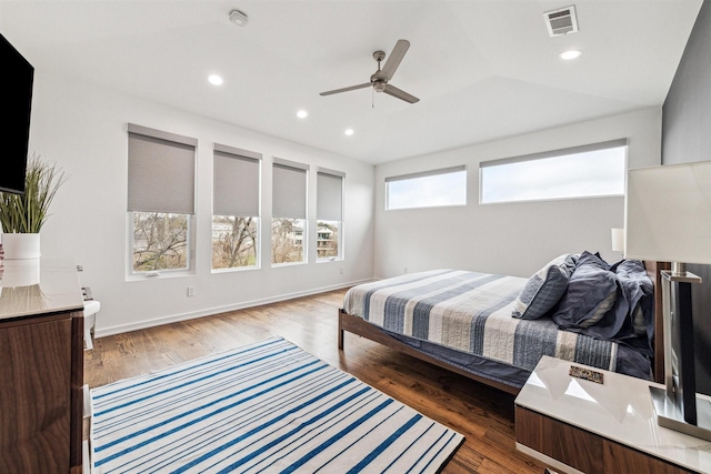 bedroom featuring a ceiling fan, wood finished floors, visible vents, and recessed lighting