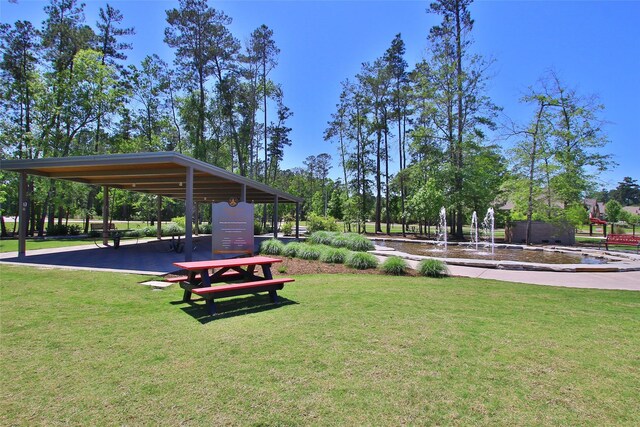 1132 Beals Creek St, Conroe, TX 77304 - view of property's community with a lawn