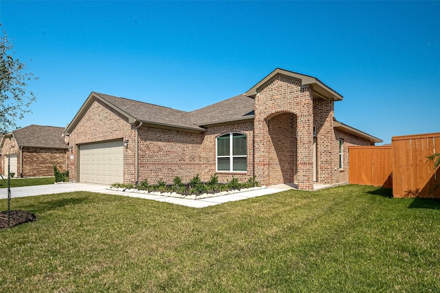 single story home with fence, a front lawn, driveway, brick siding, and a garage