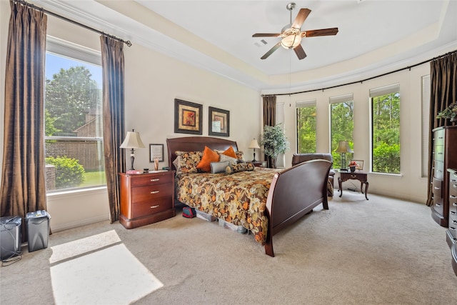 bedroom featuring carpet flooring and multiple windows