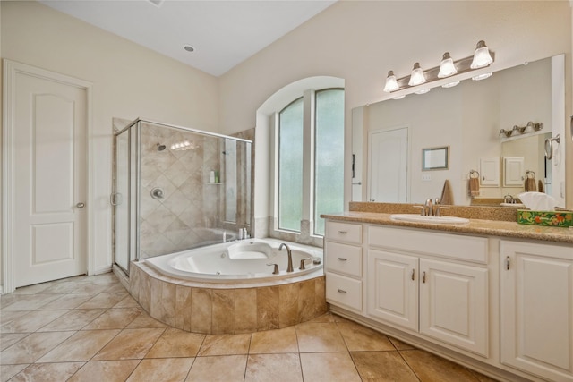 bathroom featuring a shower stall, tile patterned floors, vanity, and a whirlpool tub