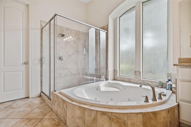 bathroom with a whirlpool tub and a stall shower
