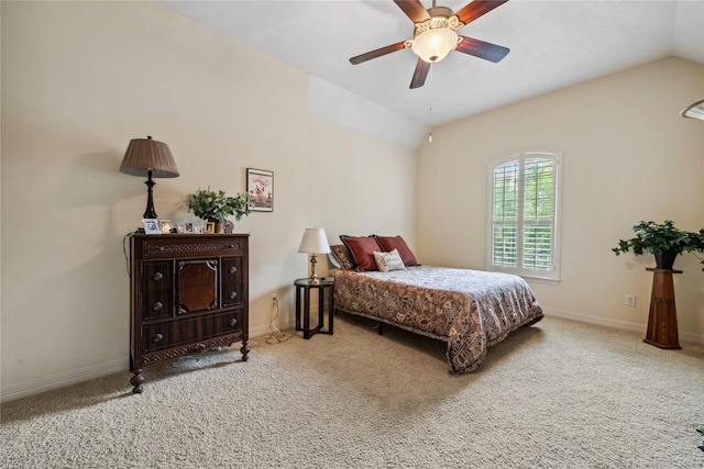 carpeted bedroom with vaulted ceiling, a ceiling fan, and baseboards
