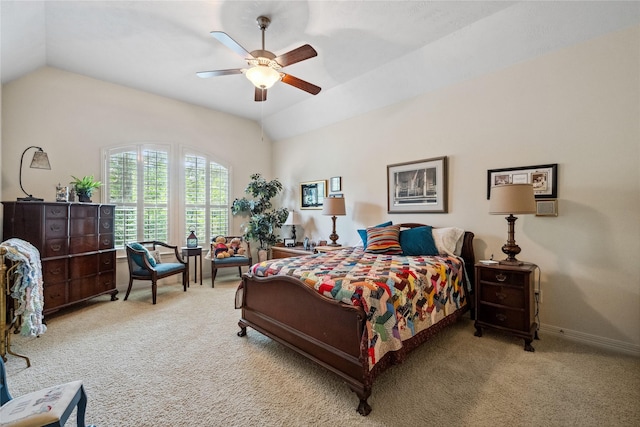 bedroom featuring lofted ceiling, baseboards, and carpet flooring