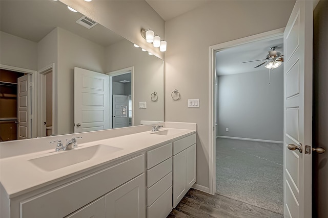 2128 Port Jackson, Texas City, TX 77568 - full bath featuring double vanity, ceiling fan, baseboards, and wood finished floors