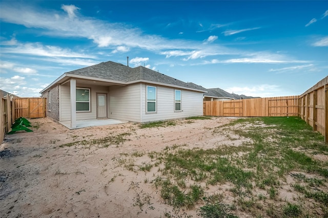 2128 Port Jackson, Texas City, TX 77568 - rear view of house with a fenced backyard, a patio area, a shingled roof, and a gate