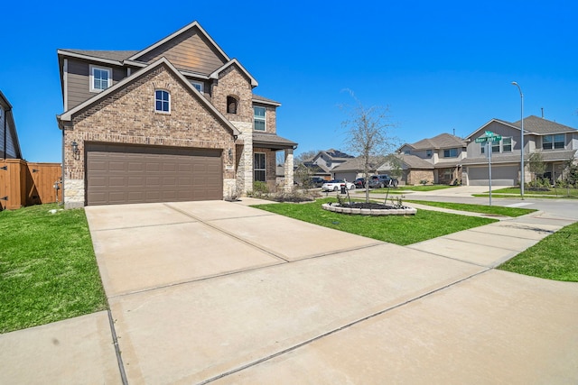 32610 Dew Crest St, Brookshire, TX 77423 - view of front of property featuring a residential view, stone siding, concrete driveway, a garage, and a front yard