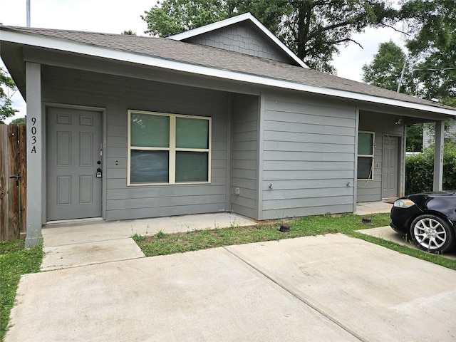 single story home with fence