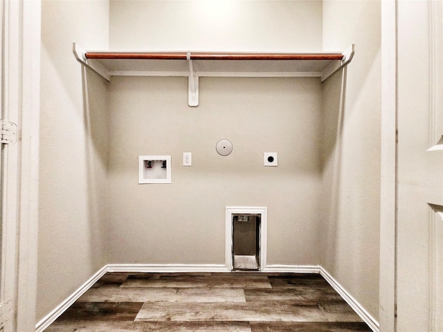 clothes washing area with hookup for a washing machine, electric dryer hookup, laundry area, hookup for a gas dryer, and dark wood-style floors