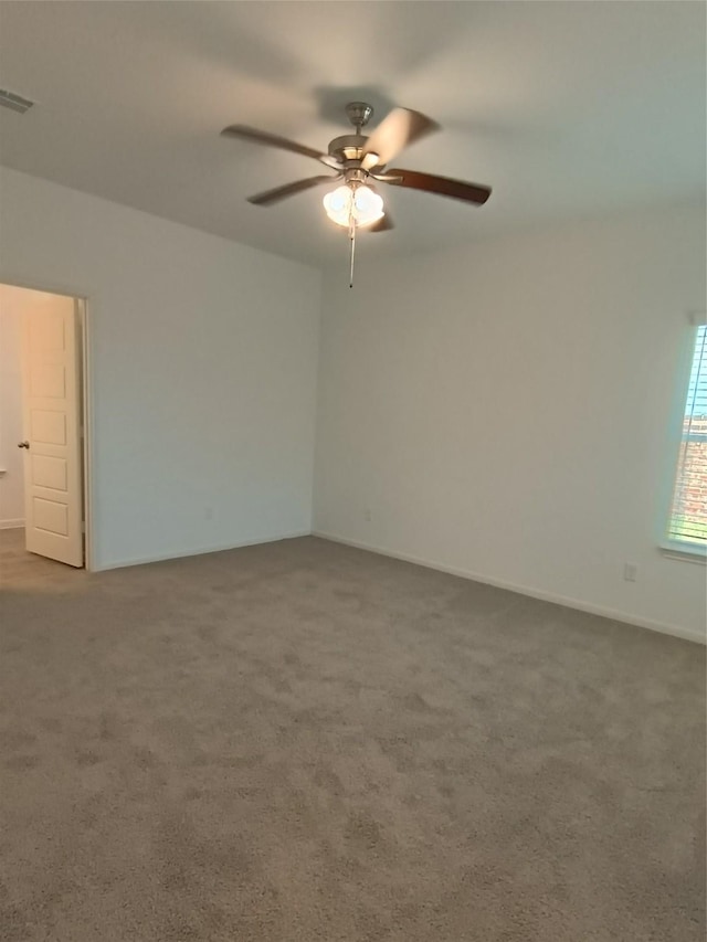 12367 Sterling Oak, Humble, TX 77044 - empty room with a ceiling fan, carpet, and baseboards