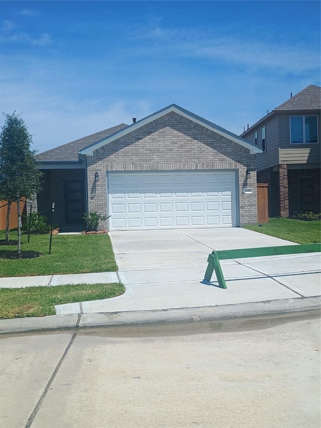 12367 Sterling Oak, Humble, TX 77044 - ranch-style house with driveway, brick siding, an attached garage, and a front lawn