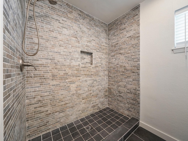 full bathroom with tiled shower