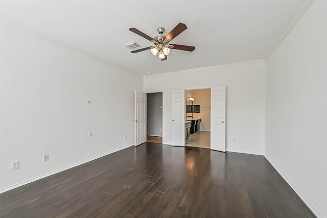 unfurnished bedroom featuring baseboards, visible vents, dark wood-style floors, and ornamental molding
