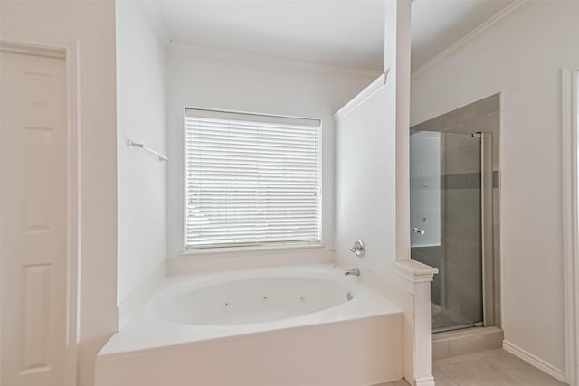bathroom with tile patterned floors, a whirlpool tub, and a stall shower