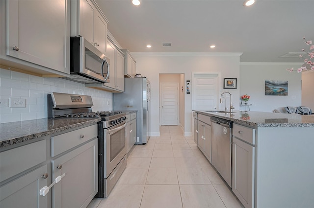 452 Long Beach Bay Dr, Katy, TX 77493 - kitchen with stainless steel appliances, a sink, ornamental molding, gray cabinets, and backsplash