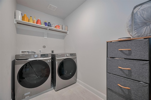 452 Long Beach Bay Dr, Katy, TX 77493 - laundry area featuring separate washer and dryer, light marble finish floors, and baseboards