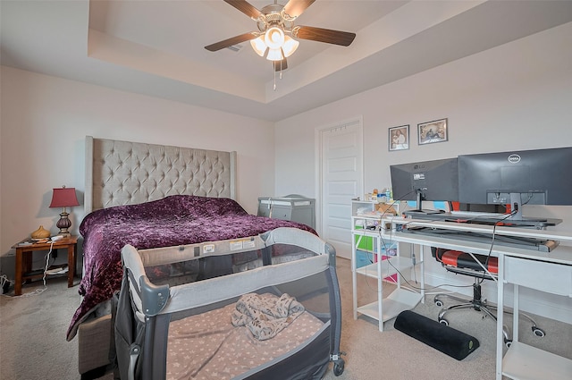 452 Long Beach Bay Dr, Katy, TX 77493 - carpeted bedroom with an office area, a tray ceiling, and a ceiling fan
