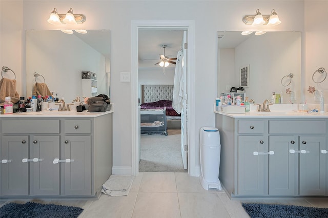452 Long Beach Bay Dr, Katy, TX 77493 - ensuite bathroom with tile patterned floors, a ceiling fan, two vanities, and baseboards