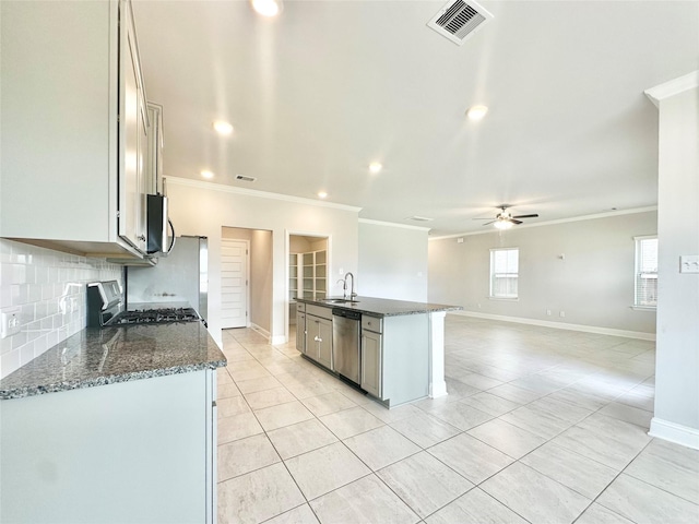 452 Long Beach Bay Dr, Katy, TX 77493 - kitchen featuring appliances with stainless steel finishes, crown molding, light tile patterned floors, tasteful backsplash, and a ceiling fan