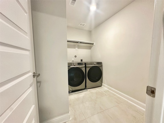 452 Long Beach Bay Dr, Katy, TX 77493 - washroom with washing machine and clothes dryer and baseboards
