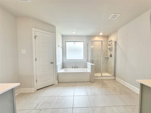 452 Long Beach Bay Dr, Katy, TX 77493 - full bath featuring vanity, a garden tub, a stall shower, tile patterned flooring, and recessed lighting