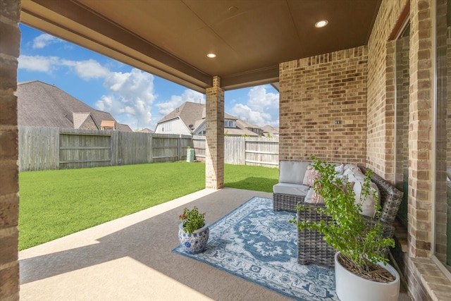 view of patio / terrace featuring a residential view and a fenced backyard