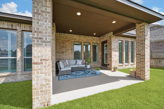 view of patio with fence and outdoor lounge area