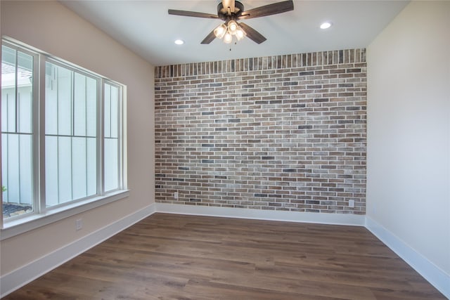spare room featuring baseboards, recessed lighting, ceiling fan, and dark wood finished floors