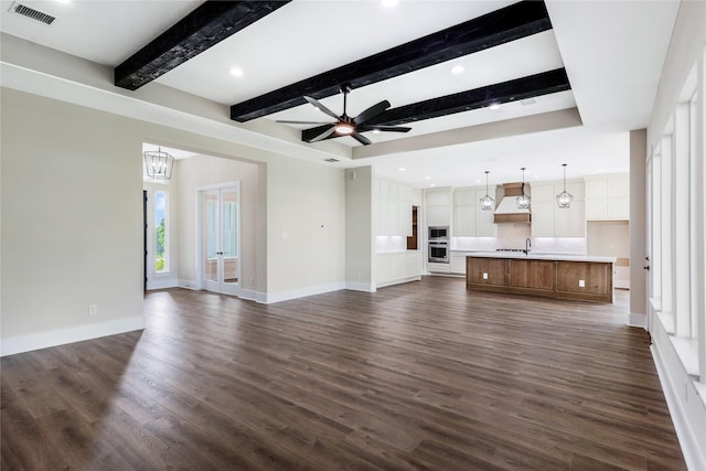 unfurnished living room with recessed lighting, visible vents, a ceiling fan, beamed ceiling, and dark wood-style flooring