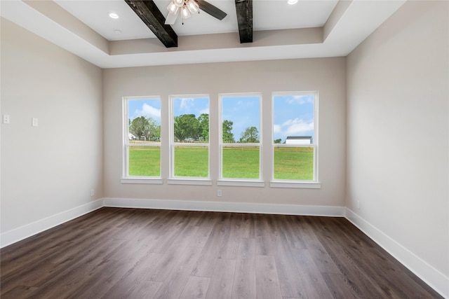 unfurnished room featuring plenty of natural light, baseboards, beam ceiling, and dark wood-style flooring