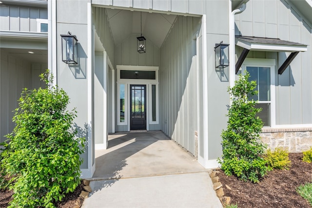 doorway to property with board and batten siding
