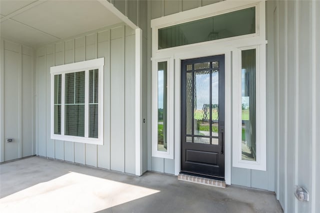 entrance to property featuring board and batten siding