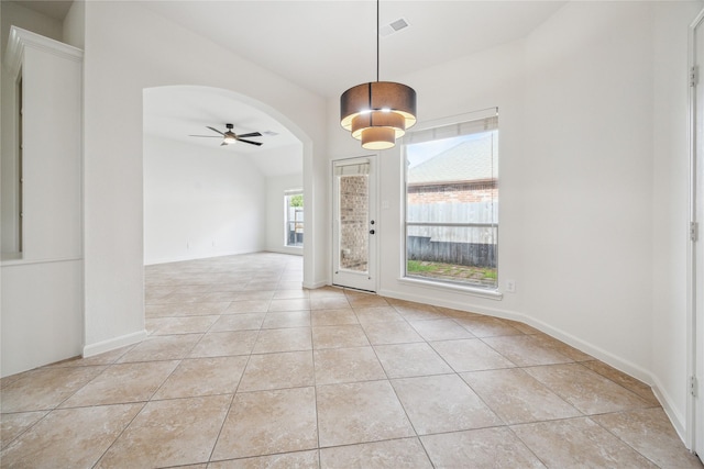 25630 Creston Meadow Dr, Richmond, TX 77406 - interior space with vaulted ceiling, light tile patterned floors, ceiling fan, arched walkways, and visible vents