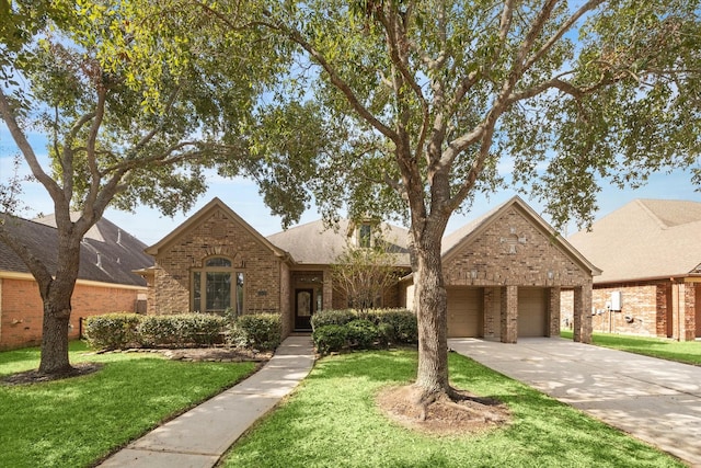 25630 Creston Meadow Dr, Richmond, TX 77406 - view of front of property featuring concrete driveway, brick siding, an attached garage, a shingled roof, and a front yard