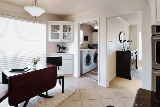 kitchen with separate washer and dryer, white cabinets, light tile patterned floors, glass insert cabinets, and a ceiling fan